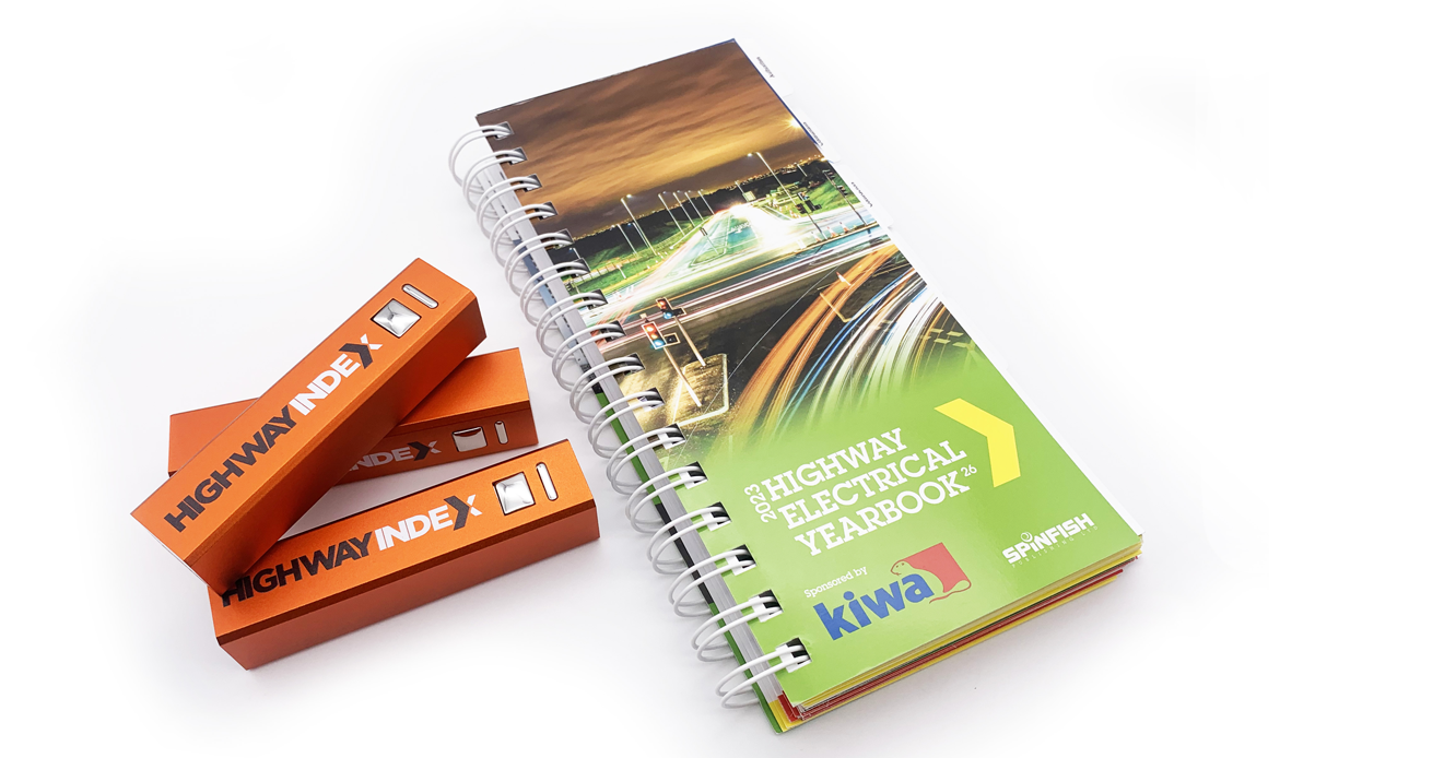 Highway Electrical Yearbook with 3 orange Highway Index powerbanks on the left