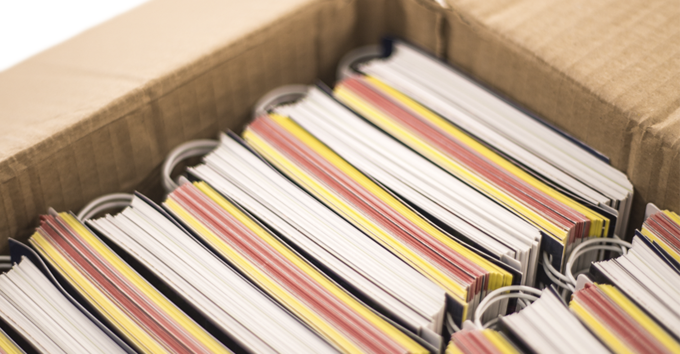 Box of Highway Maintenance Yearbooks, neatly stacked